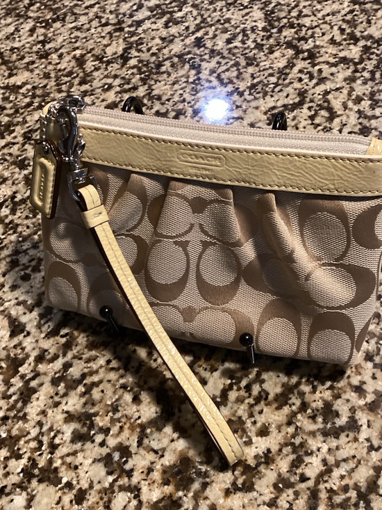 Coach Handbags - Coach Beige Signature Canvas Wristlet with  yellow leather trim